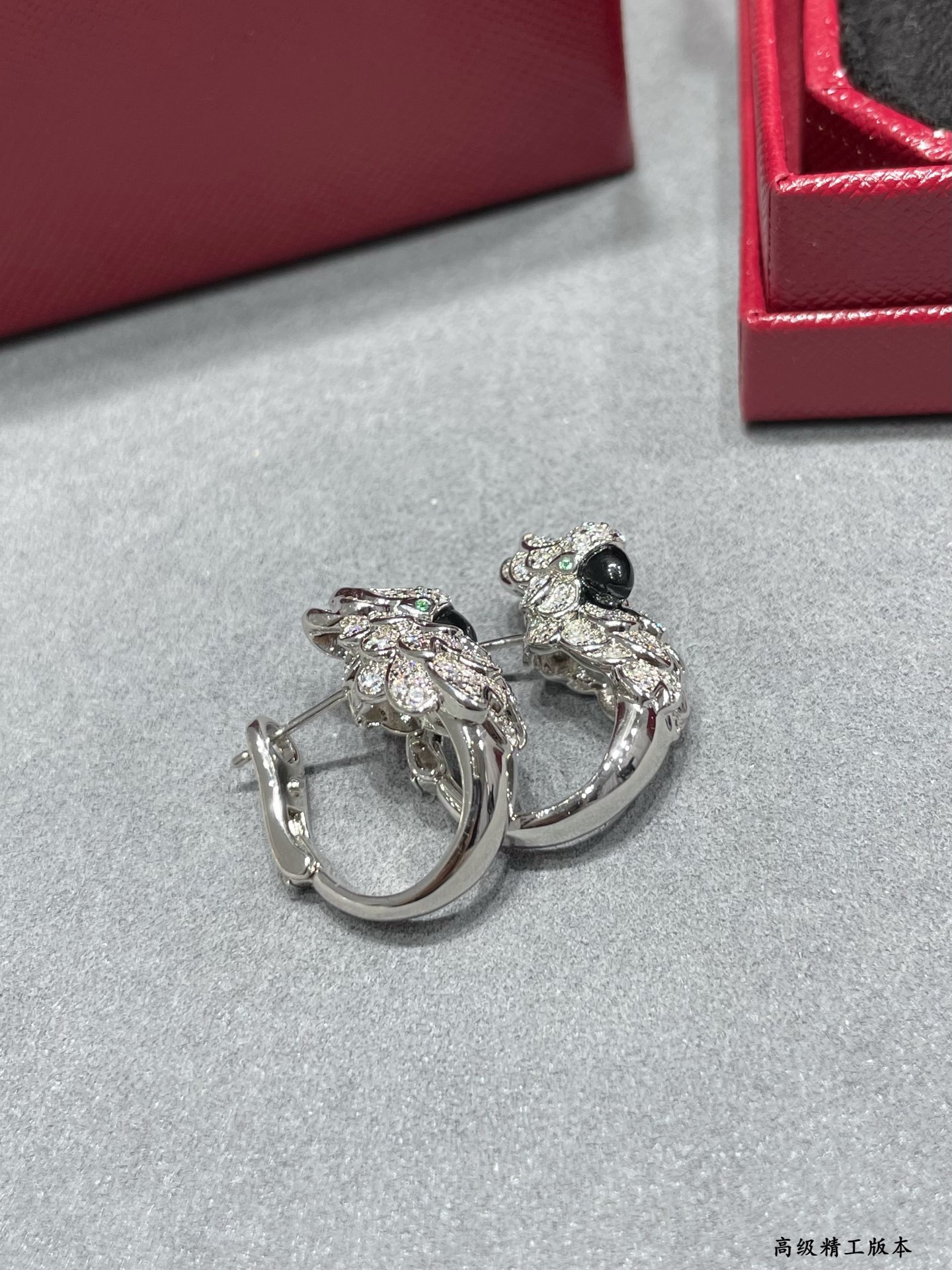 Ca*t1er Parrot Earrings