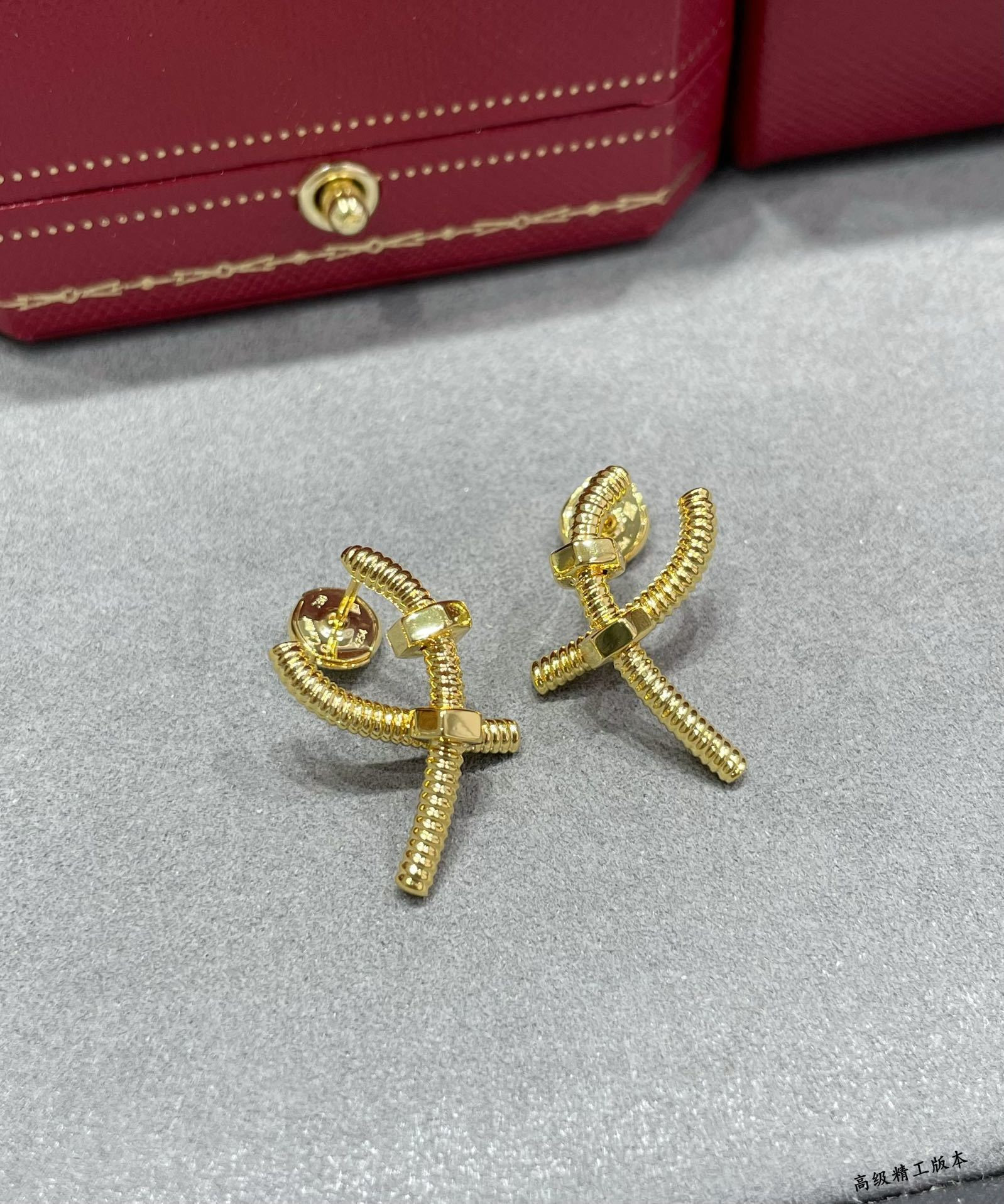 Ca*t1er Cross Screw Earrings