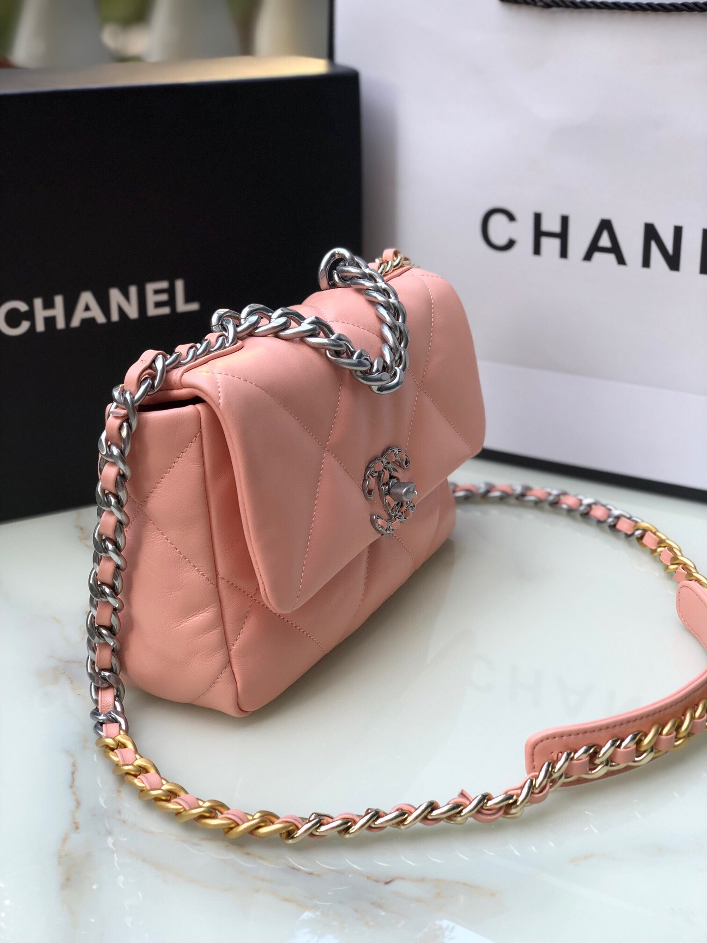 Ch**el 19 HANDBAG Shiny Leather, Gold-Tone, Silver-Tone & Ruthenium-Finish Metal Light Pink 6.2 × 10.1 × 3.5 in