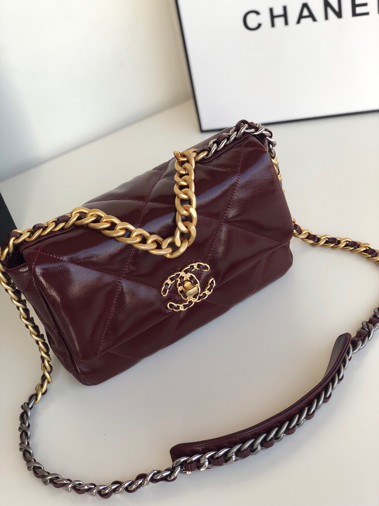 Ch**el 19 HANDBAG Shiny Leather, Gold-Tone, Silver-Tone & Ruthenium-Finish Metal Dark Red 6.2 × 10.1 × 3.5 in
