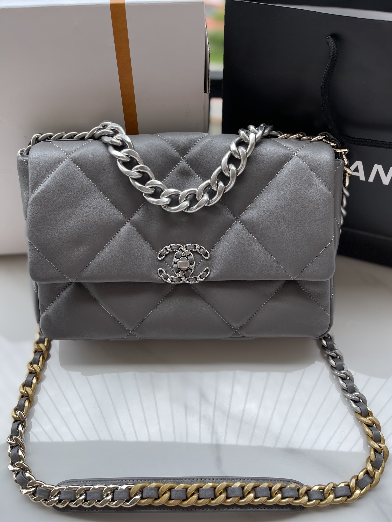 Ch**el 19 LARGE HANDBAG Shiny Leather, Gold-Tone, Silver-Tone & Ruthenium-Finish Metal Gray 7.8 × 11.7 × 3.9 in