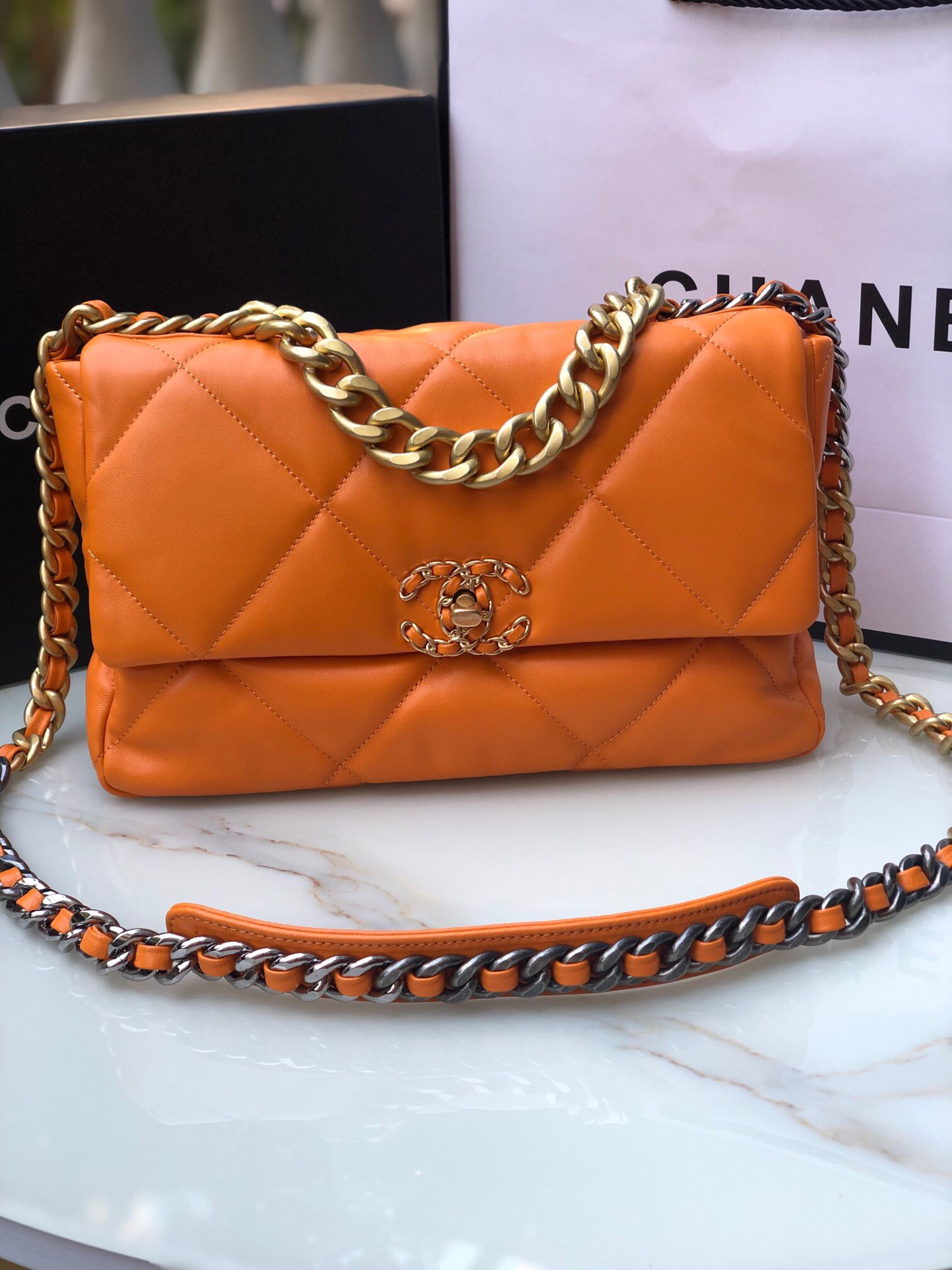Ch**el 19 LARGE HANDBAG Shiny Leather, Gold-Tone, Silver-Tone & Ruthenium-Finish Metal Orange 7.8 × 11.7 × 3.9 in