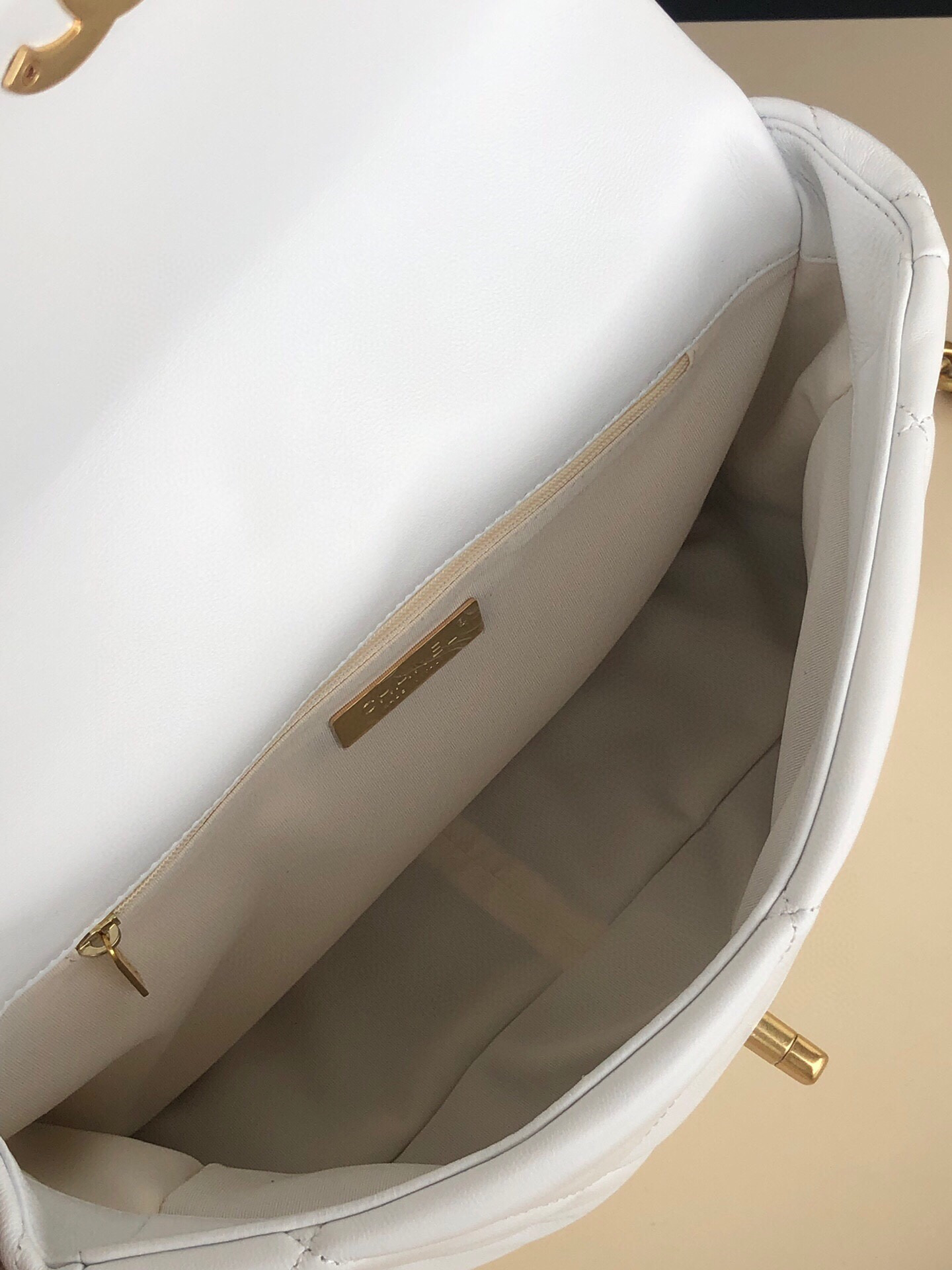 Ch**el 19 LARGE HANDBAG Shiny Leather, Gold-Tone, Silver-Tone & Ruthenium-Finish Metal White 7.8 × 11.7 × 3.9 in